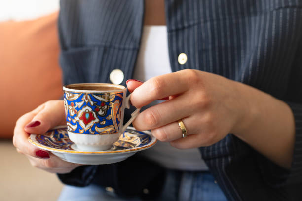 istock A woman holding a cup of Turkish coffee 2199441447