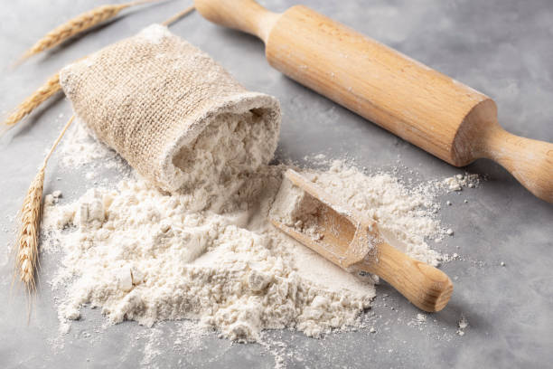 istock Flour in a burlap bag and a wooden spoon 2199442319