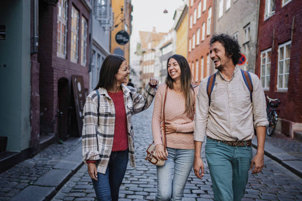 istock Tourists walking and laughing in Copenhagen, Denmark 2199450636