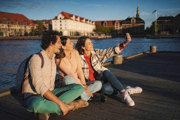 istock Smiling tourists taking selfie in Copenhagen, Denmark 2199451314
