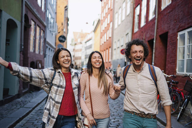 istock Tourists walking and laughing in Copenhagen, Denmark 2199451368