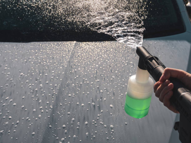 istock Manual car high-pressure wash using equipment for effective dirt removal and coating protection. 2199453233