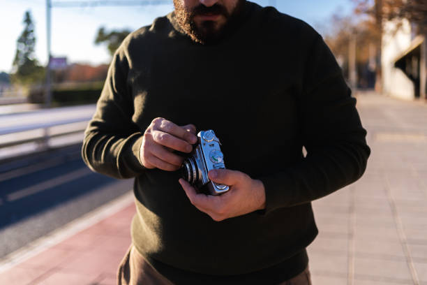 Photographer setting up his vintage camera outdoors