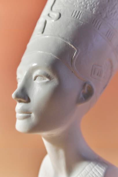 Refined depiction of a sculpture in profile, highlighting intricate craftsmanship and soft curves. The warm, diffused tonal backdrop accentuates the subject, giving a sense of timeless beauty and tranquility.