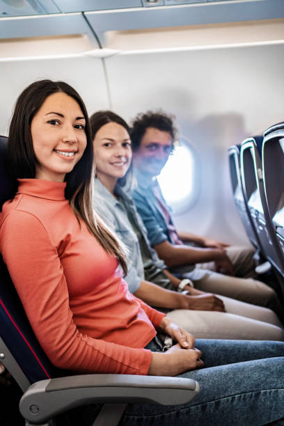 istock Young tourists smiling during a flight to Malmo, Sweden 2199456401
