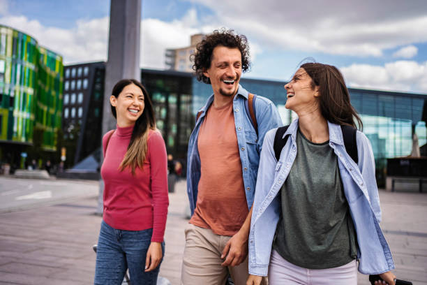 istock Cheerful tourists walking and laughing in Malmo, Sweden 2199456482