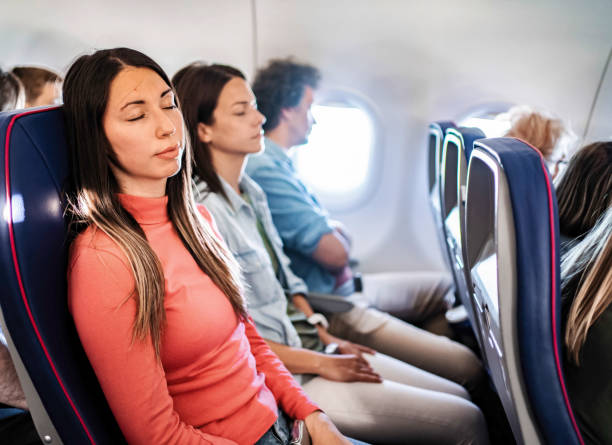 istock Young woman sleeping during a flight to Malmo, Sweden 2199456531