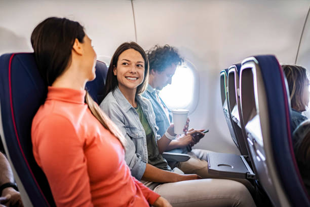 istock Young women chatting during flight to Malmo, Sweden 2199456578