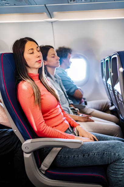 istock Young woman sleeping during a flight to Malmo, Sweden 2199456587