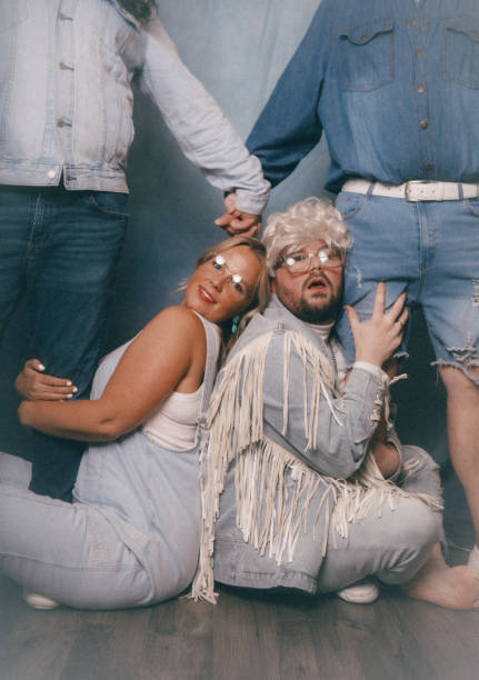 istock Awkward Retro Glamour Shots Of Denim Dressed Siblings 2199466440