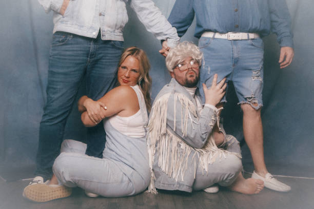 istock Awkward Retro Glamour Shots Of Denim Dressed Siblings 2199466443