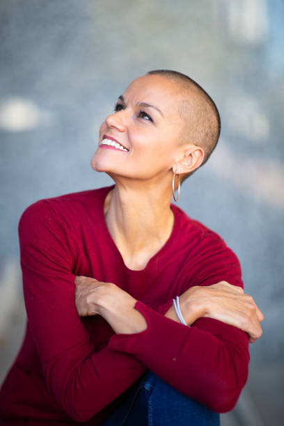Close up middle age woman with head shaved
