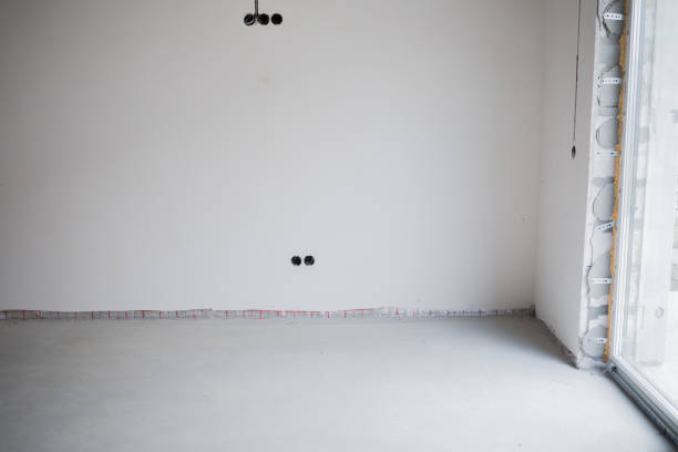 Empty room ready for decoration with neutral walls and smooth flooring.