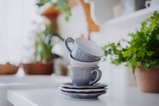 istock Elegant stacked cups with saucers in a cozy kitchen setting 2199472598