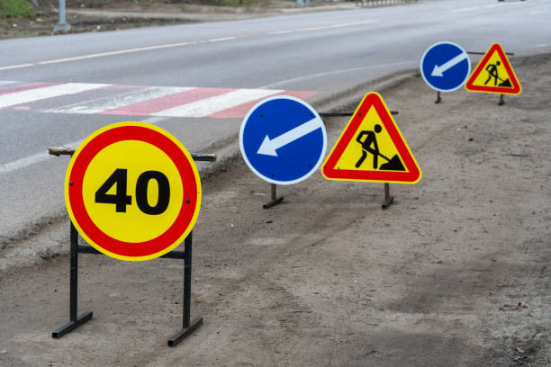 istock Colorful traffic signs are placed along a road section under construction, highlighting limits and guiding drivers 2199477402