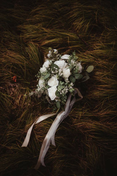 istock Wedding flower bouquet with white silk roses and sheer ribbon 2199481205