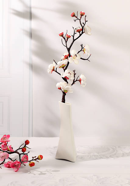 istock Abstract spring flower arrangement with cherry blossom branches in vase,elegant beauty concept,stage for product display and business concept.Minimal modern aesthetics 2199485773