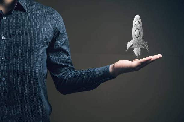 istock The rocket takes off from the network. Startup concept. Man holding in his hand 2199487955