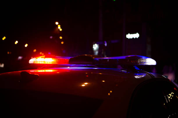 istock Police car in the night city 2199488179