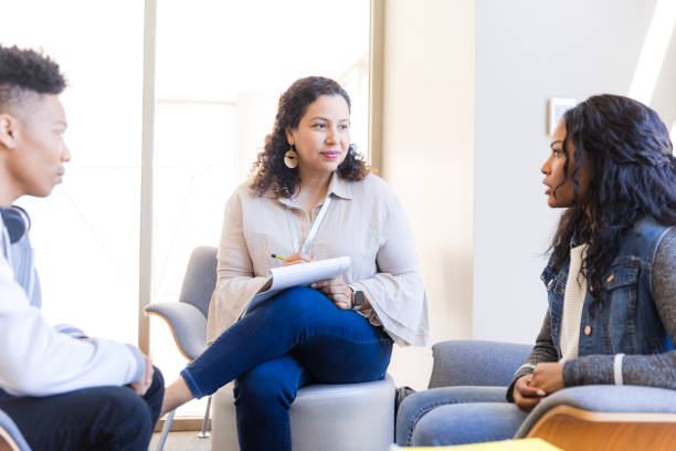 istock Group therapy session:  Mental health professional counseling diverse patients 2199488464