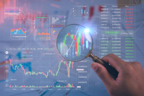 istock businessman holding magnifying glass and blurred trading data chart background looking for an opportunity investment in stock market 2199493996