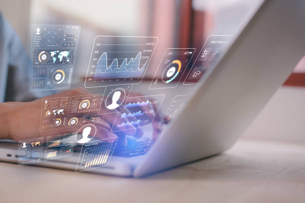 istock A businessman is sitting at desk typing on computer laptop working with data charts, DEVOPS data analysis and development digital information and technology 2199494079