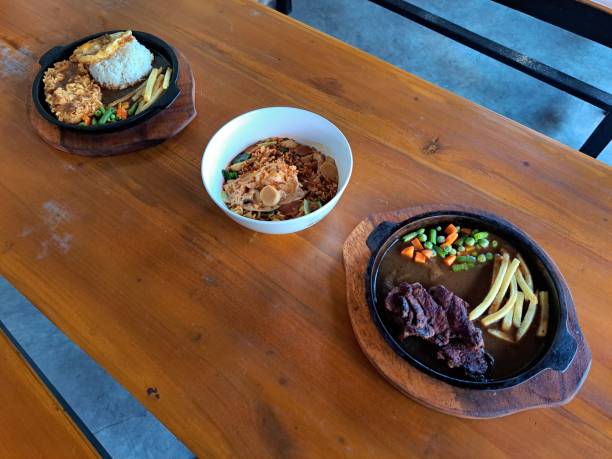istock Pan Seared Beef Steak, Mi Goreng Telur Or Fried Noodle Egg And Crispy Rice Egg Chicken Steak. Food Menu. 2199496329