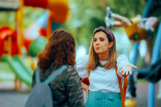 istock Women at a Playground Fighting with Each Other about Kid Raising 2199503676