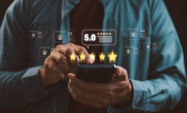 istock Hand using phone give five-star rating to service experience, Customer review satisfaction feedback survey concept. Customer review satisfaction feedback survey concept. 5 star score, Positive Review. 2199505475
