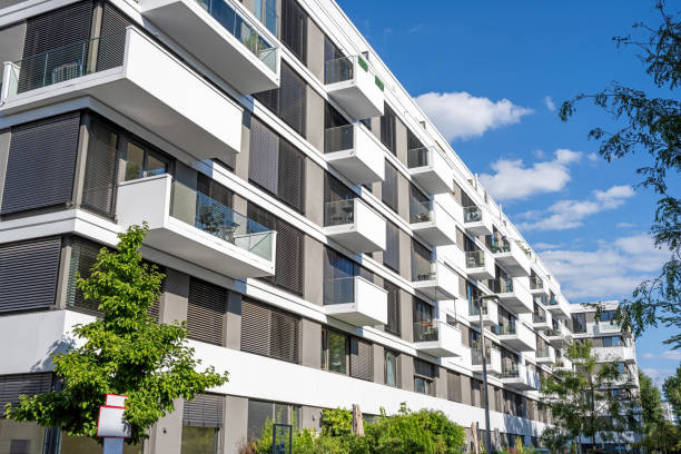 istock Gray-white multi-family residential building 2199514273