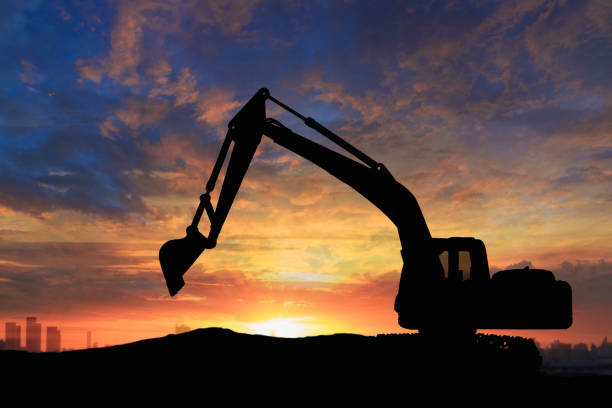 istock Crawler excavators silhouette  in the construction site. 2199516778