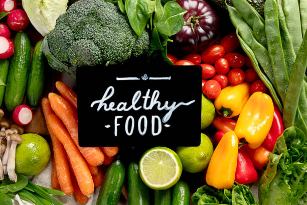 Organic fresh vegetables on a light background. Vegetarian, vegan concept. Top view.