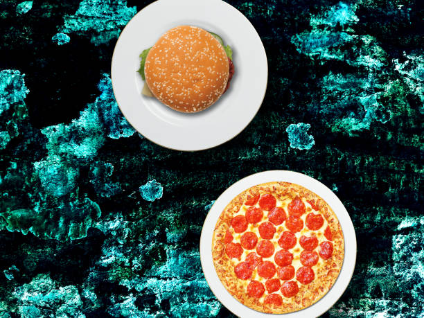 Burger and Pizza top angel background. Waiter provide customer burger and pizza. Food background with dark light table