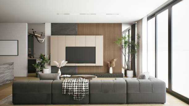 istock A modern living room featuring a sleek sofa, wooden accents, large windows, and greenery, creating a bright and inviting atmosphere. 3d rendering. 2199525983