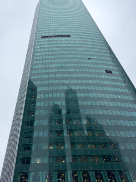 istock A tall building with many windows and a cloudy sky in the background 2199527578