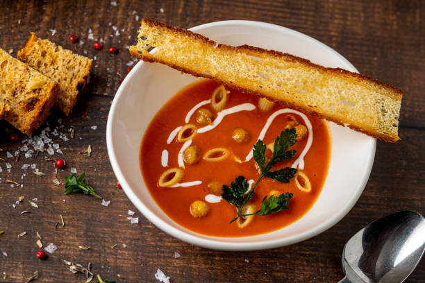 istock Tomato soup with pasta, roasted chickpeas, cream, and toast on top 2199531693