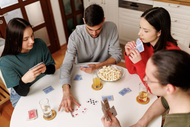 istock Friends playing modern board game together at home 2199536289