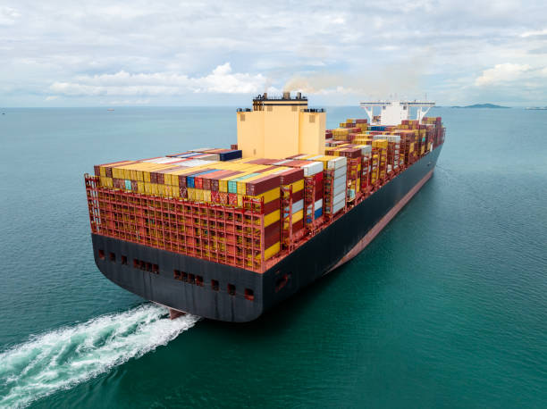 istock cargo container ship carrying sailing in sea import export goods and distributing products to dealer consumers across Asia pacific and worldwide global business transportation by container ship, 2199540660