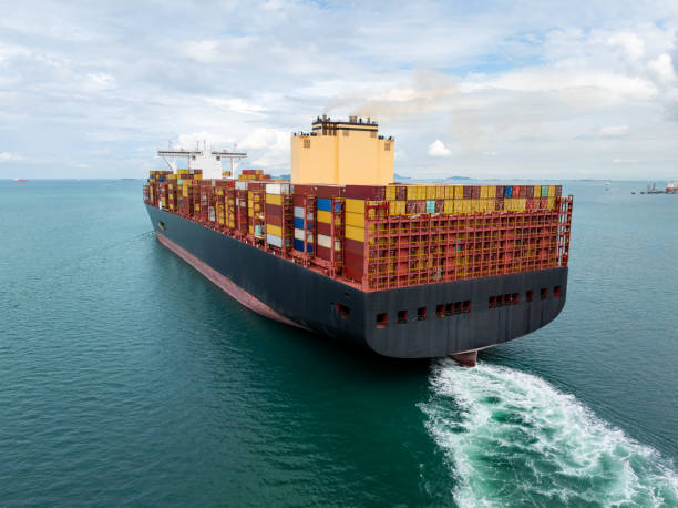 istock cargo container ship carrying sailing in sea import export goods and distributing products to dealer consumers across Asia pacific and worldwide global business transportation by container ship, 2199540672
