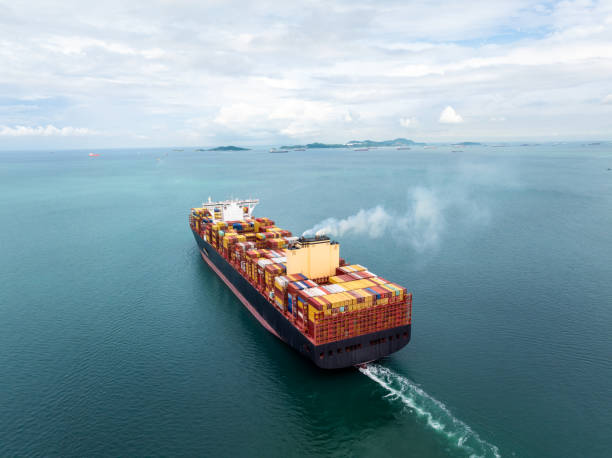 istock cargo container ship carrying sailing in sea import export goods and distributing products to dealer consumers across Asia pacific and worldwide global business transportation by container ship, 2199540679