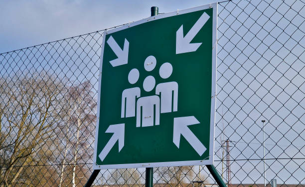 istock Additional table for marking the place where the assembly point is located. It is advisable to supplement the table with a text table or an arrow. escape routes from the building, photoluminescent 2199542866