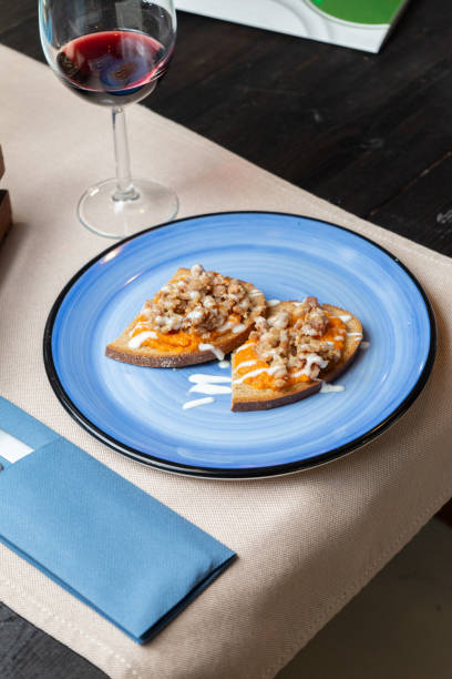 Crostini with pumpkin, sausage and cheese