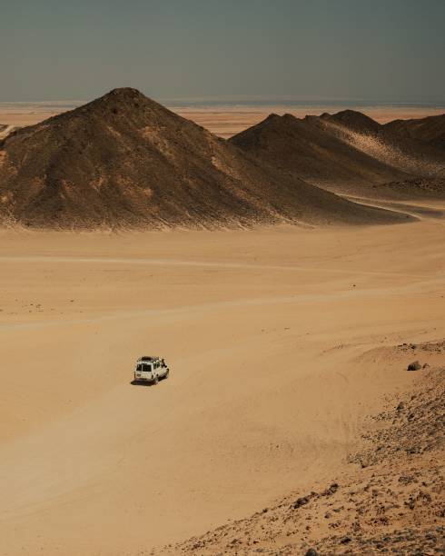 istock Off-road vehicle in desert landscape. 2199545696