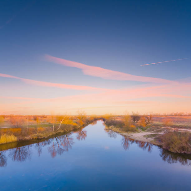 view to the long calm river at the evening