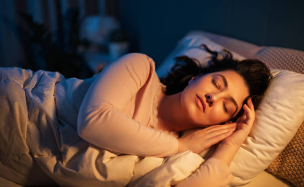 istock Woman is sleeping in her bedroom 2199552928