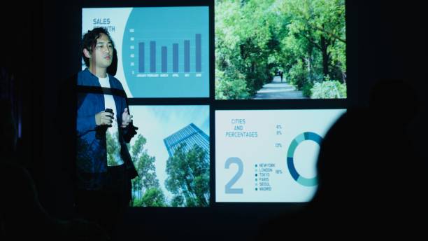 istock Young Businessman Presents Sustainability Data at Night Meeting 2199553807
