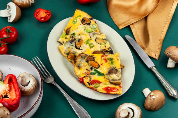 istock Homemade egg omelette or omelet with mussels. 2199554270