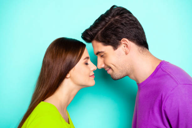 istock Close-up profile side view portrait of his he her she nice attractive dreamy affectionate cheerful cheery couple cuddling isolated over bright vivid shine vibrant green turquoise background 2199561332