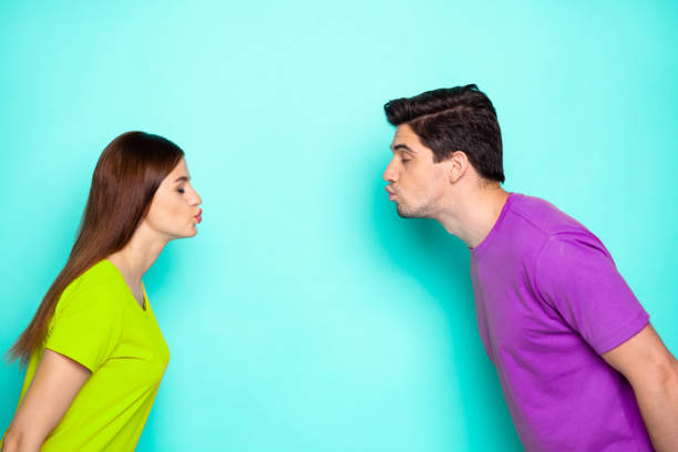 istock Profile side view portrait of his he her she nice attractive dreamy affectionate couple leaning kissing isolated over bright vivid shine vibrant green turquoise background 2199561333