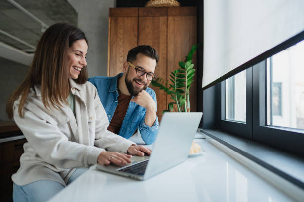 istock Young Adults Collaborating on Laptop in Office 2199565230